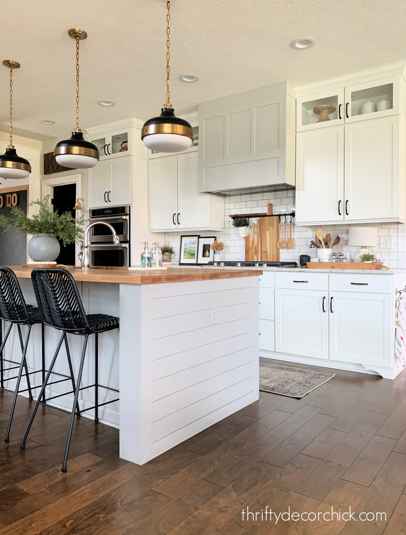 white kitchen black brass lights