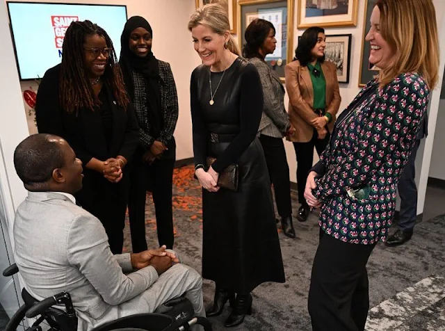 The Countess of Wessex wore an Anagram-belt leather midi dress by Loewe, Victoria Beckham crepe dress and green blazer