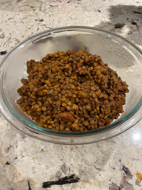 bowl of brown cooked lentils
