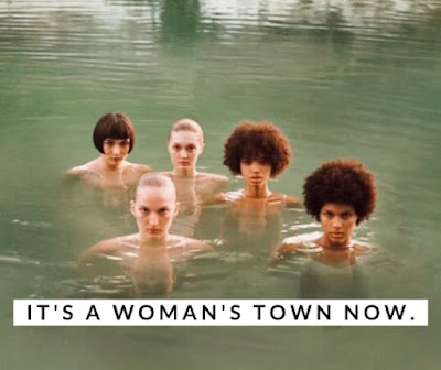 Five young ethnically diverse women staring intensely as the camera from the water with the caption It's A Woman's Town Now