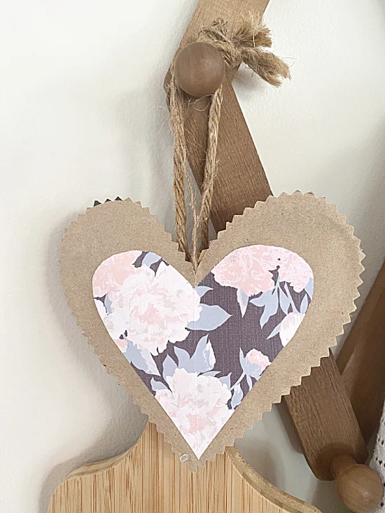 paper heart hanging on hooks