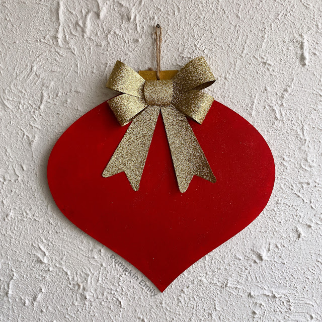 Red Wooden Ornament Wall Hanging with a Bow