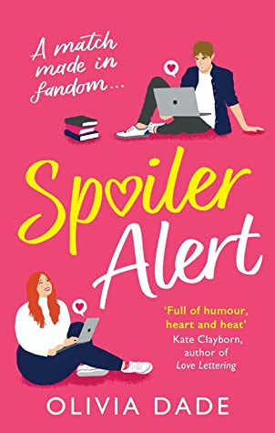 Spoiler Alert Olivia Dade - UK Cover. pink background with title in yellow and 2 illsutrated figures of a couple on laptops.
