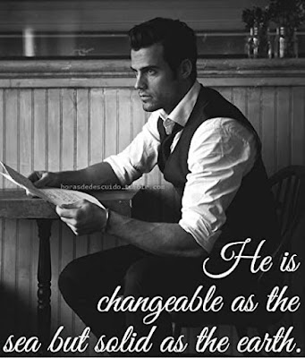 Black and white photograph of a handsome man in a waistcoat holding a newspaper and looking outward the caption reads He is changeable as the sea but solid as the earth