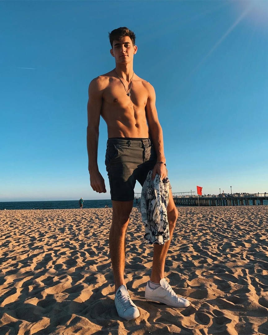 cute-shirtless-fit-college-guy-skinny-body-beach