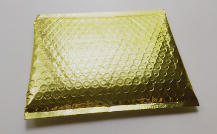 Laserbrain Patch Co. ships their subscription in a gold bubble mailer. Photo credit: My Subscription Addiction