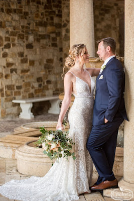 bride and groom in bella collina atrium