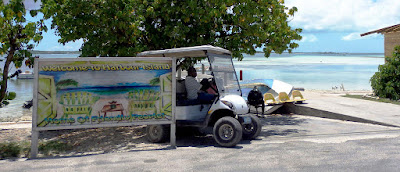 Harbour Is., welcome sign by the sea