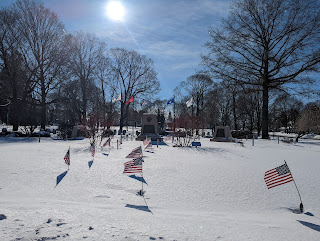 the Town Common memorials are covered and flags flapping