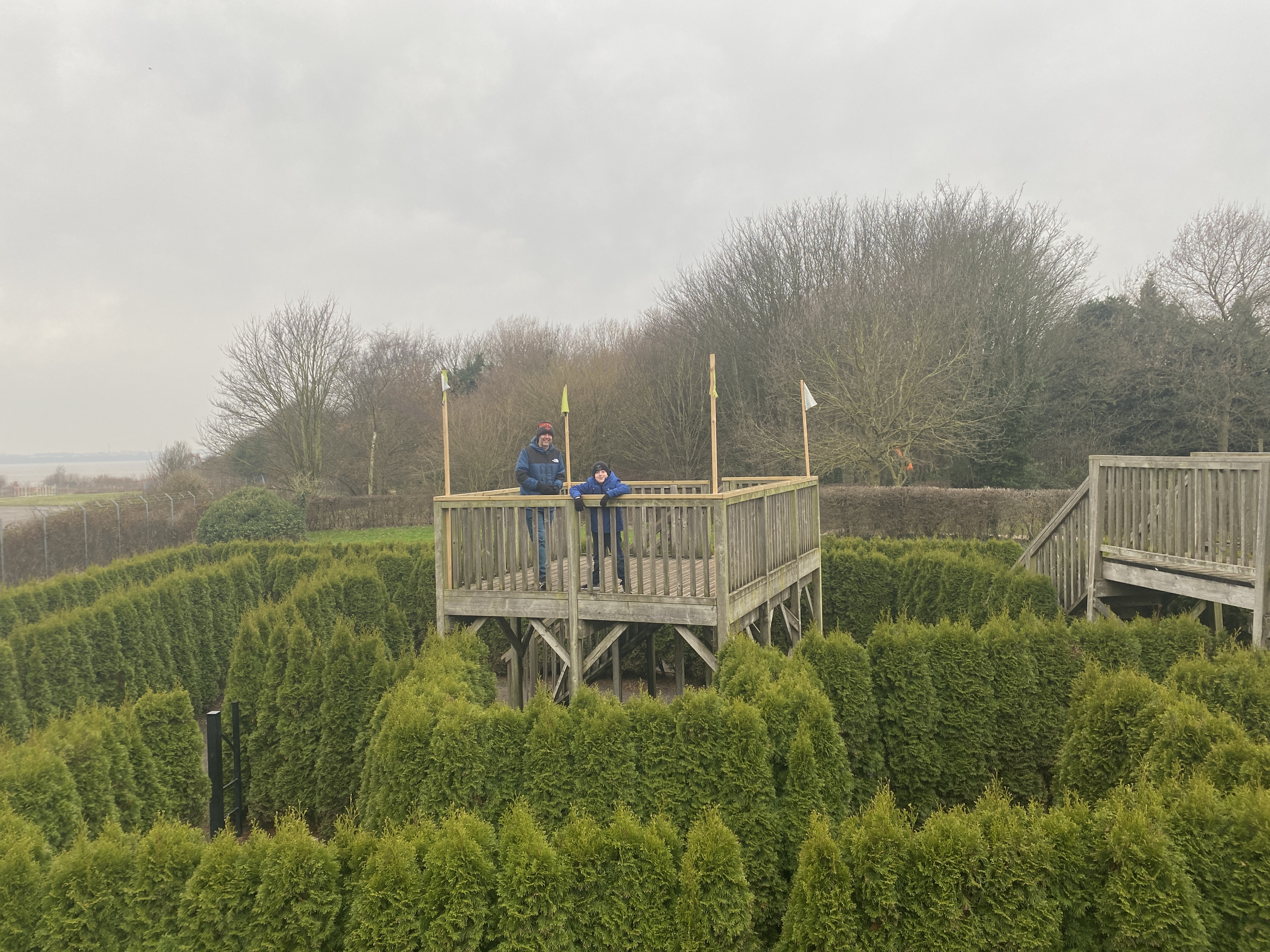 man and boy in a maze