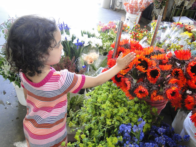 girl touching flowers