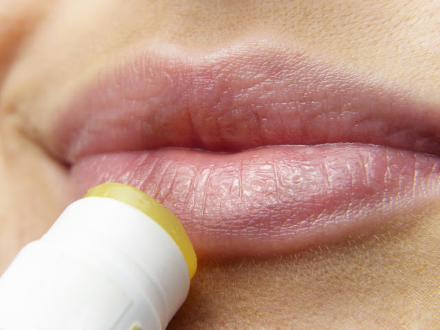 applying lip balm