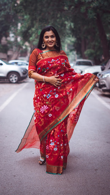 Red Pure zari Kota Doria saree. The jamdani design has been revived from a royal museum piece.