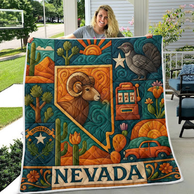 Superior quilt with Nevada state symbols, sunset, ram, cacti, and desert scenery.