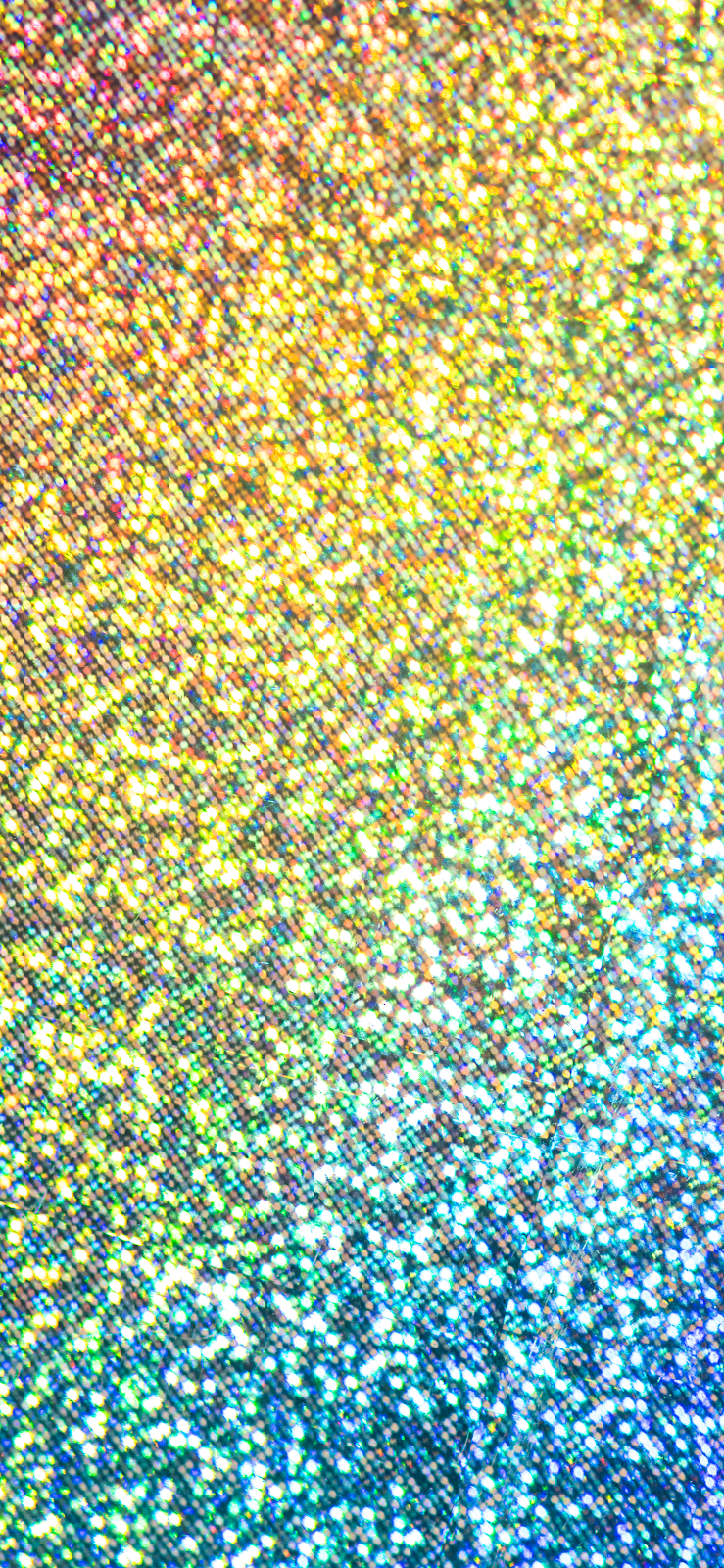 A vibrant rainbow ombre gradient wallpaper with shimmering glitter