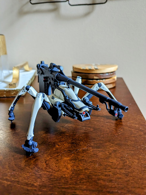 a spider-like robot with a gun on its back