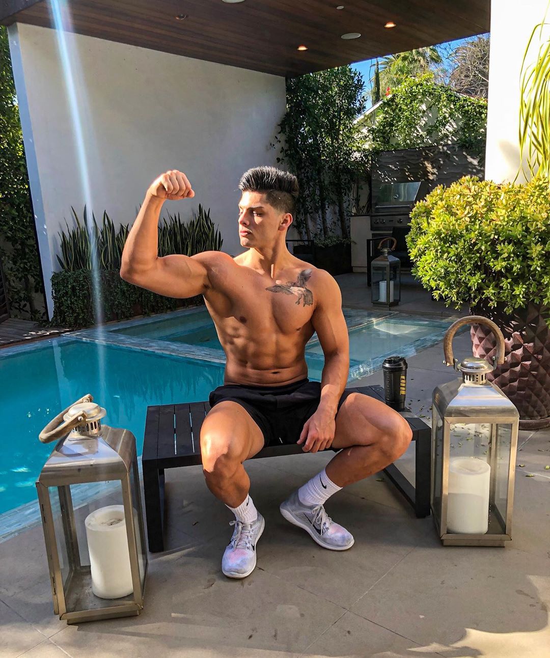 sexy-cocky-young-latino-pool-guy-shirtless-fit-body-biceps-flex-summer