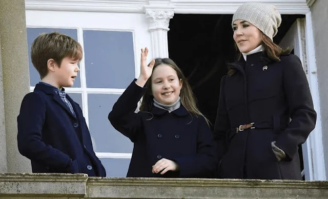 Crown Princess Mary wore a dark brown wool coat by Prada, Princess Josephine wore a navy coat by Gucci. Princess Isabella