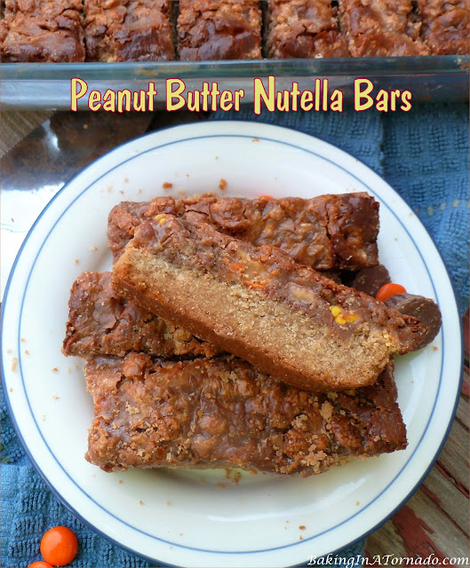 Peanut butter Nutella Bars have everything you love, cookie butter, peanut butter, Nutella, and so much more. | recipe developed by www.BakingInATornado.com | #recipe #dessert