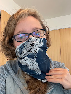 Me wearing a snood with an illustration of the Kelpies on it.