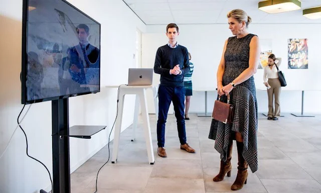 Queen Maxima wore a mixed check belted coat and asymmetrical flannel tweed midi dress by Oscar de la Renta