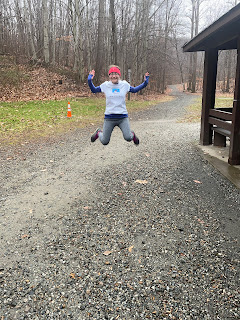 Me jumping in the air in my race shirt before the 10k.