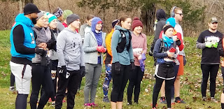 The half marathon runners waiting in a huddle for the race to start.