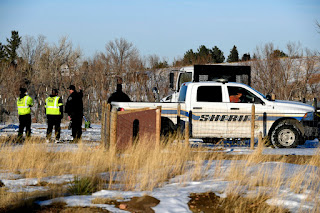 Boulder County officials investigate a property along Colorado 93 near Eldorado Springs Drive in Boulder, Colorado on Jan. 2, 2022.