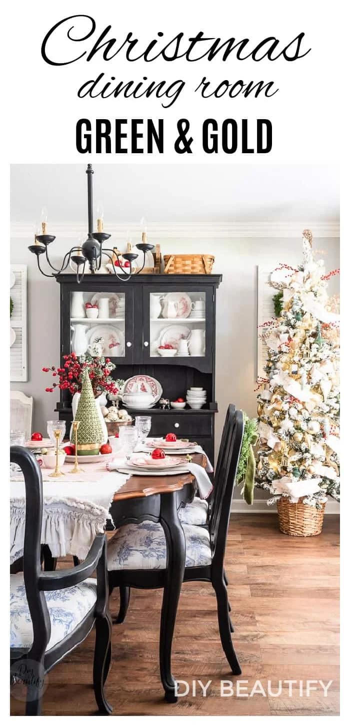 elegant Christmas dining room with green and gold tree and red berries and ornaments