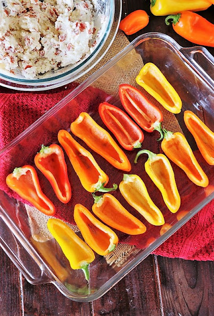 Halved Mini Bell Peppers in Baking Dish Image
