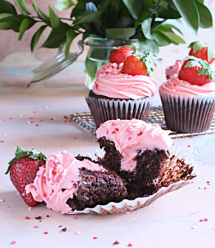 Recipe for tender chocolate cupcakes, filled and frosted with a strawberry cream cheese frosting.
