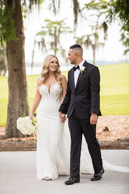 bride and groom holding hands