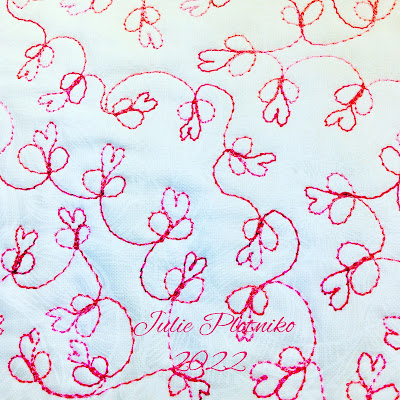 A free motion quilting design of loops and hearts