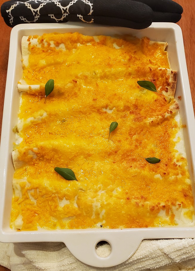 white sauce enchiladas baked in a casserole revol dish