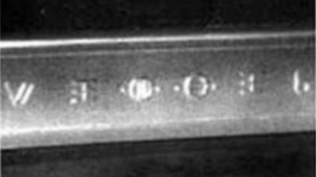 Alien symbols on a crashed UFO debris cross beam section.