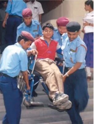 Disabled person being carried