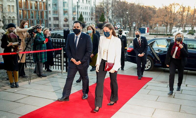 Princess Ingrid Alexandra wore a white blazer by Stella McCartney. Aspinal of London wine red clutch. Crown Princess Mette-Marit