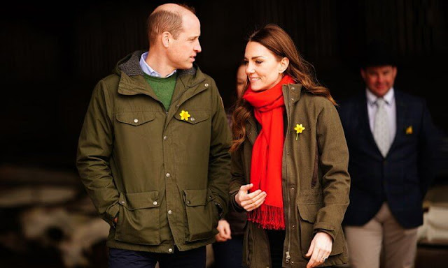 Kate Middleton wore a green long belted coat by Sportmax, and green woodcock advanced jacket by Seeland