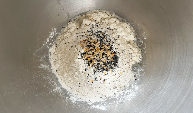 Adding the flour and spice mix to the yeast
