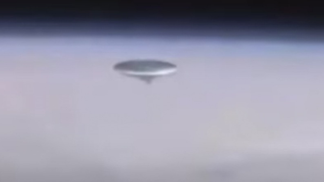 This UFO incident if real, happening at the ISS looks like a silver metallic Flying Saucer.