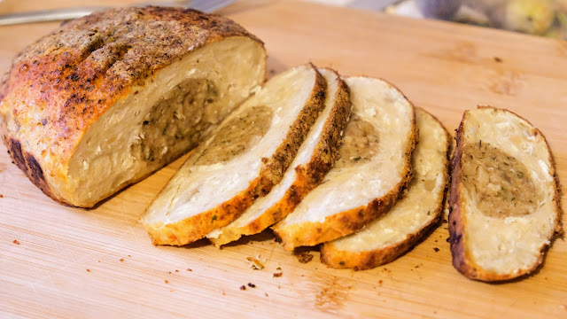 No-Turkey Crown Roast sliced on a wooden chopping board