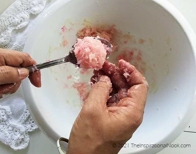 Forming pink coconut macaroons