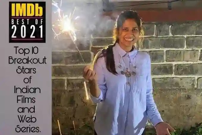 Actress Sai Tamhankar standing with sparkler in hand wearing simple kurta and imdb top 10 breakout stars announcment text written beside sai's image