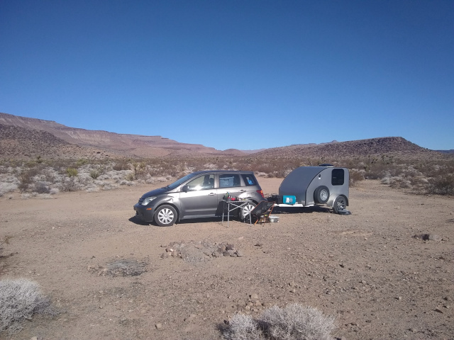 car and trailer and desert hills