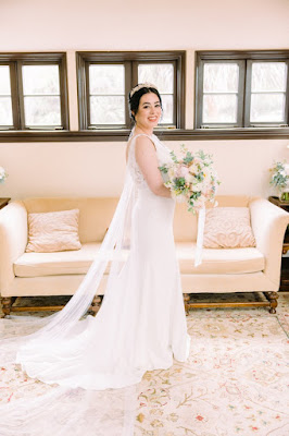 bride in white dress with flowers