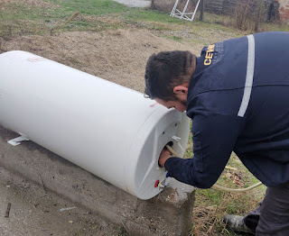 Cleaning out the damaged boiler