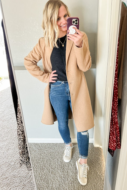Wool dad coat over a black sweater with jeans and sneakers.