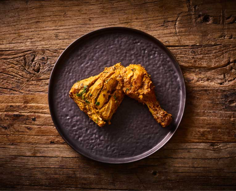 Chicken drumstick & thigh marinated in tandoori spices and baked in a tandoor oven