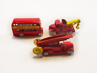 The Matchbox Originals of the double decker bus, a tow truck, and an old fire truck. They're red and yella, fella