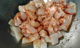 Marinated squid with red chilli powder, ginger garlic paste